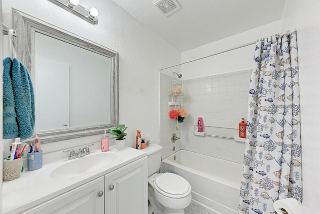 full bathroom featuring a textured ceiling, shower / tub combo with curtain, vanity, and toilet