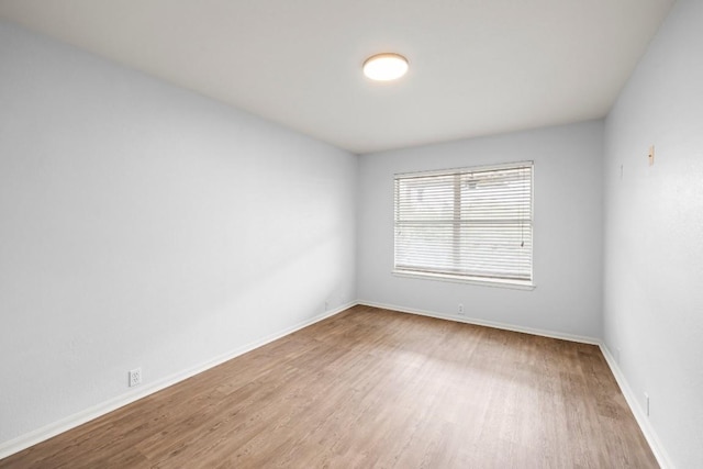 unfurnished room featuring wood-type flooring