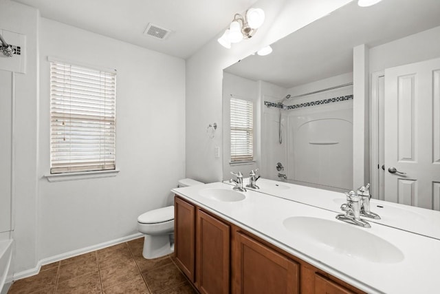 full bathroom featuring shower / bathing tub combination, vanity, toilet, and tile patterned floors