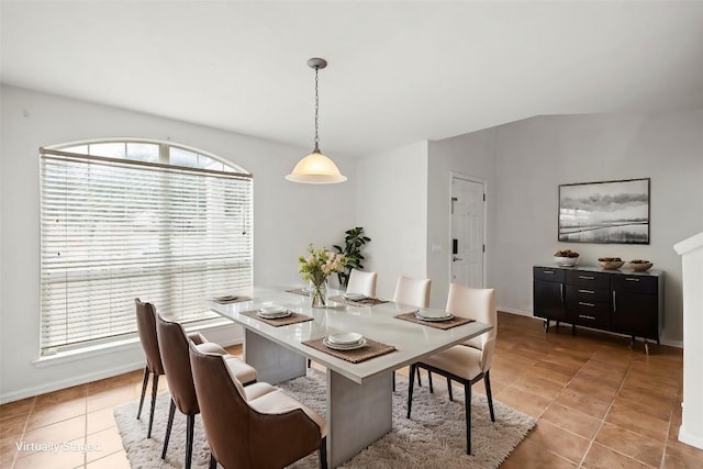 dining space with light tile patterned floors