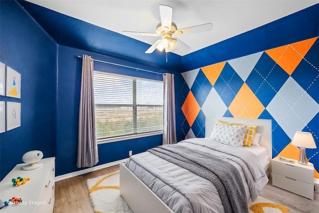 bedroom featuring ceiling fan and light hardwood / wood-style flooring