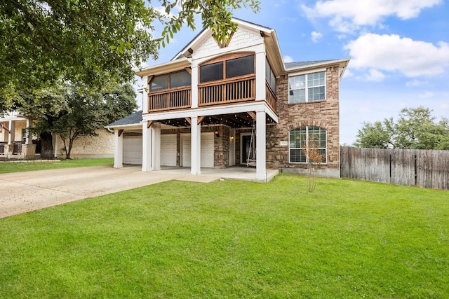 view of front of home with a garage and a front yard