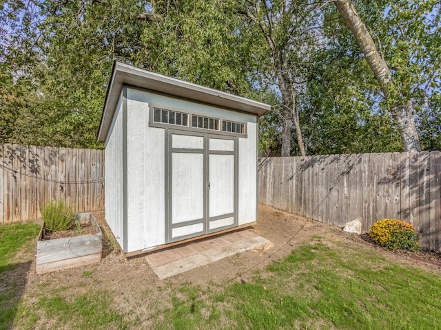 view of outbuilding featuring a yard