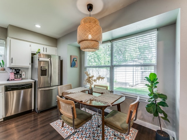 dining room featuring dark hardwood / wood-style flooring