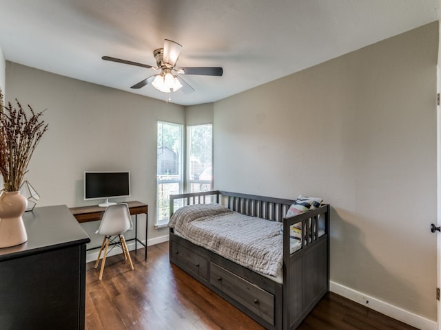 bedroom with ceiling fan and dark hardwood / wood-style floors