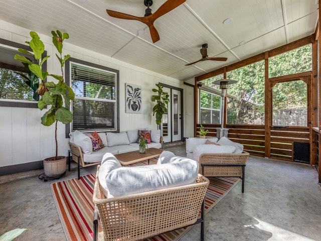 sunroom / solarium with ceiling fan and plenty of natural light