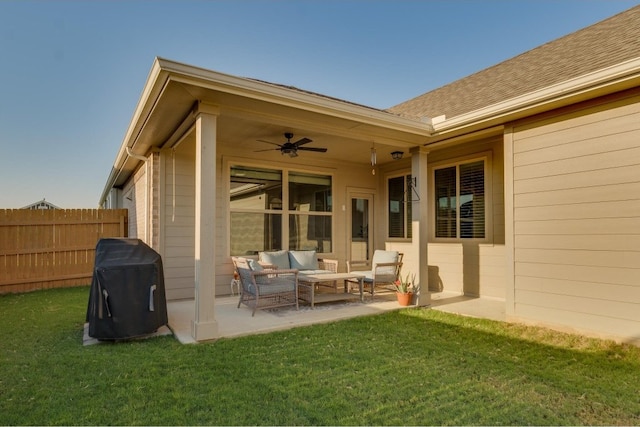 rear view of house featuring a lawn, outdoor lounge area, ceiling fan, and a patio