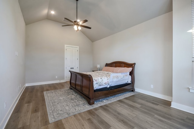 bedroom featuring hardwood / wood-style floors, ceiling fan, and vaulted ceiling