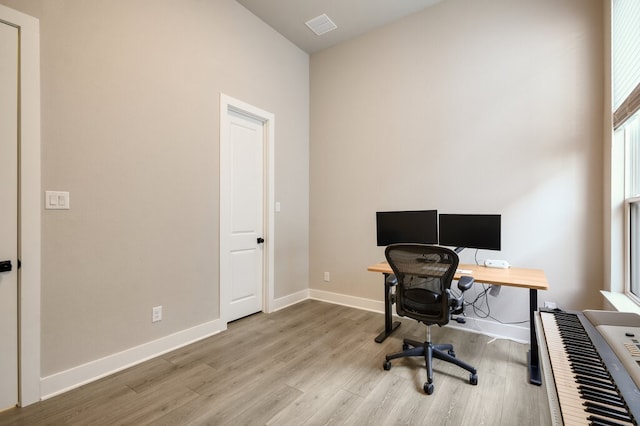 home office featuring light hardwood / wood-style floors