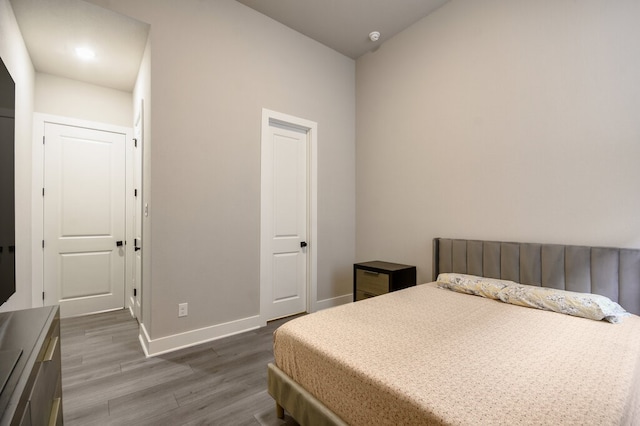 bedroom with hardwood / wood-style flooring