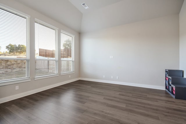 spare room featuring dark wood-type flooring