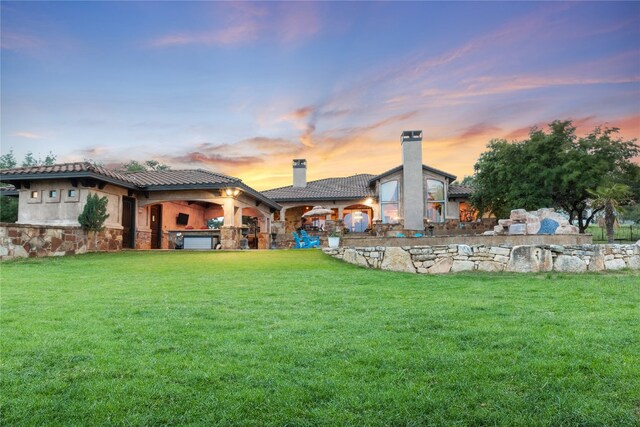 yard at dusk with a patio