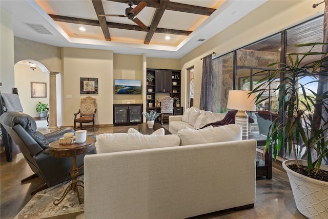 4609 Boxwood Bnd, Lago Vista, TX 78645 - living room featuring coffered ceiling, ceiling fan, ornate columns, concrete floors, and beam ceiling