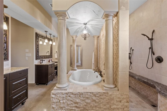 bathroom featuring a bath, vanity, a walk in shower, and decorative columns