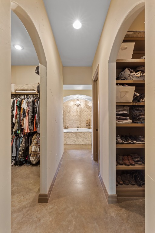 4609 Boxwood Bnd, Lago Vista, TX 78645 - corridor featuring baseboards, arched walkways, and recessed lighting