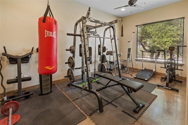 exercise area with baseboards, a ceiling fan, and recessed lighting