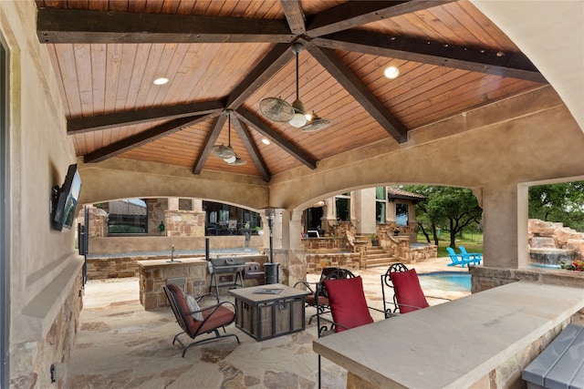 4609 Boxwood Bnd, Lago Vista, TX 78645 - view of patio / terrace featuring exterior kitchen, a gazebo, a ceiling fan, and an outdoor fireplace
