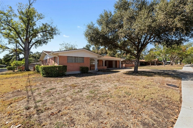 1311 Ridgehaven Dr, Austin, TX 78723 - ranch-style house featuring brick siding and driveway