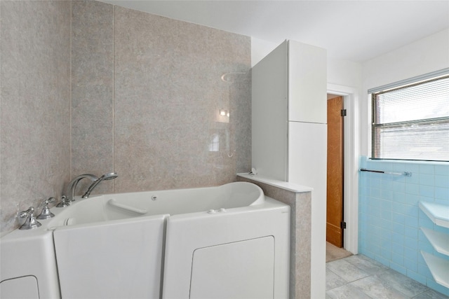 1311 Ridgehaven Dr, Austin, TX 78723 - full bath featuring tile walls, a bath, and tile patterned flooring