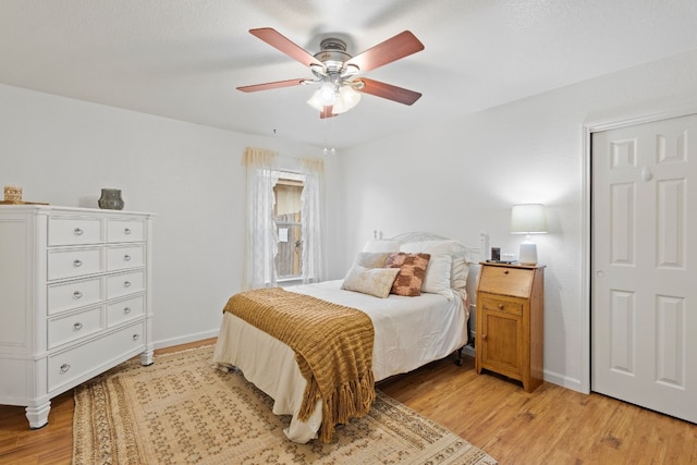 bedroom featuring ceiling fan and light wood-type flooring