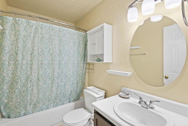 full bathroom with vanity, a textured ceiling, toilet, and shower / bathtub combination with curtain