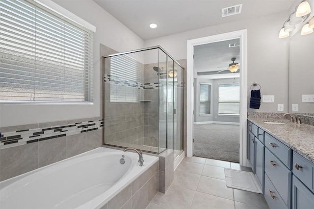 bathroom featuring tile patterned floors, separate shower and tub, vanity, and ceiling fan