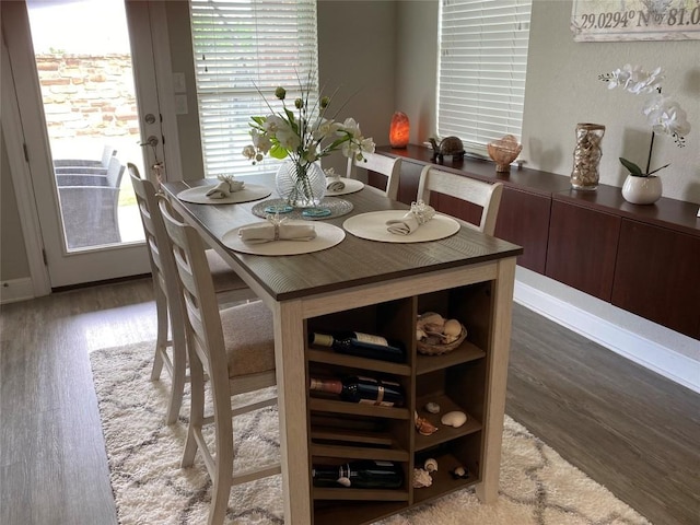 dining area with wood-type flooring