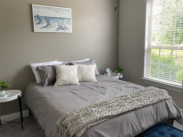 bedroom with multiple windows