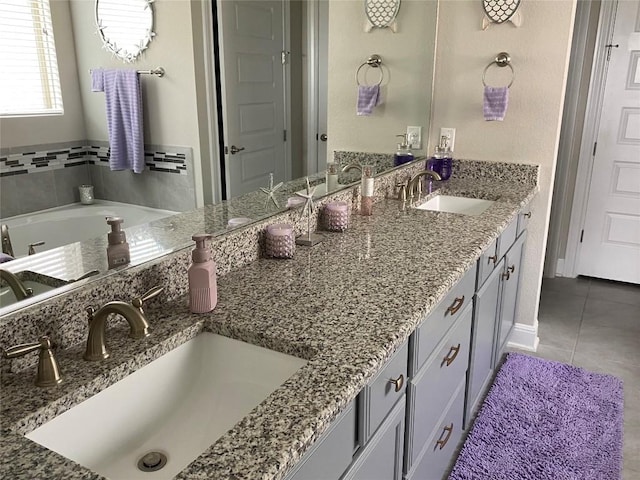 bathroom with tile patterned floors and vanity