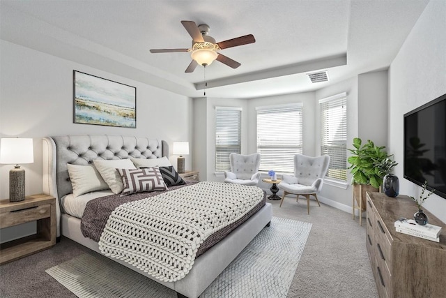 bedroom with ceiling fan and light colored carpet