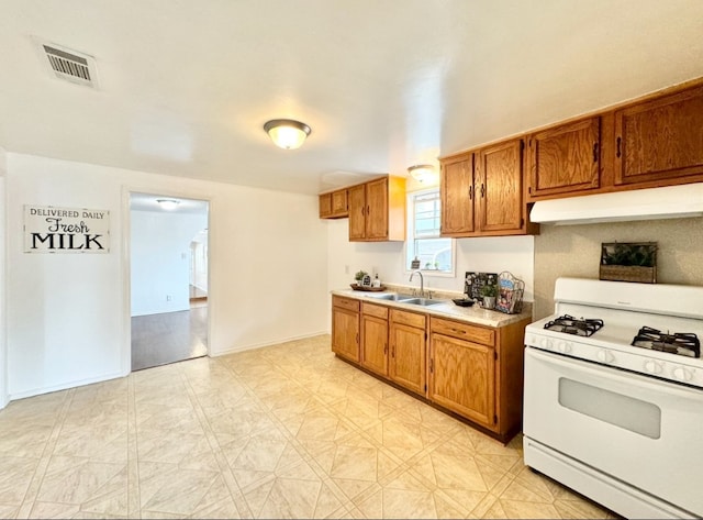 kitchen with gas range gas stove and sink