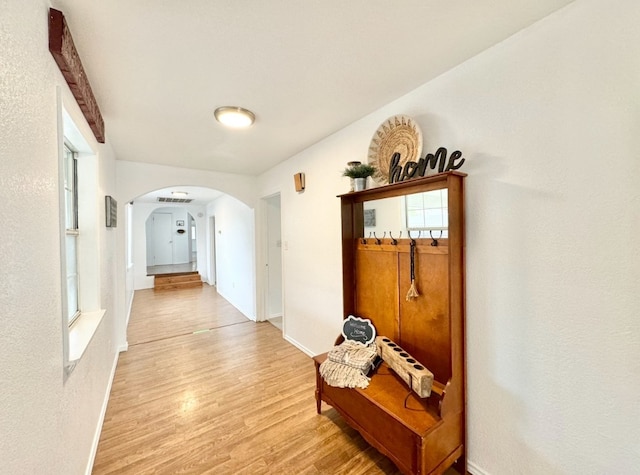 hall with light hardwood / wood-style flooring