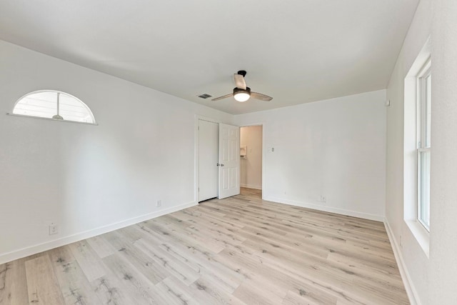 unfurnished room with ceiling fan and light hardwood / wood-style floors