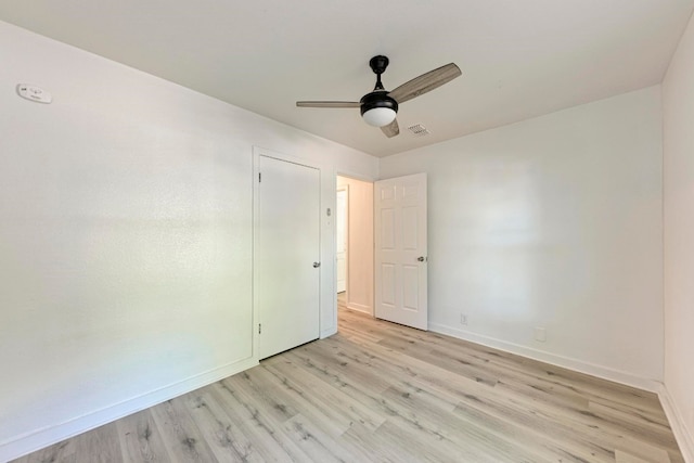 empty room with light wood-type flooring and ceiling fan