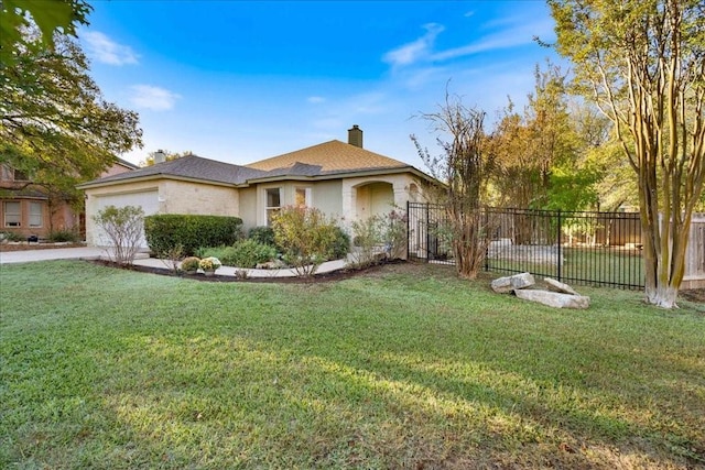 view of front of home featuring a garage and a front yard