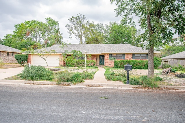 ranch-style house featuring a garage