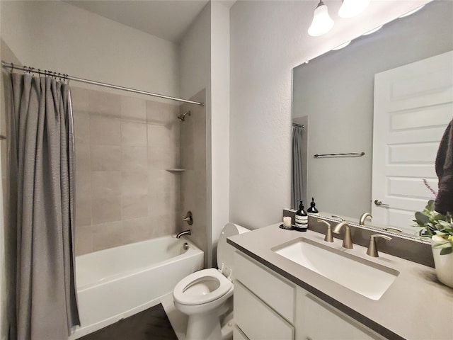 full bathroom featuring shower / bath combo with shower curtain, vanity, and toilet