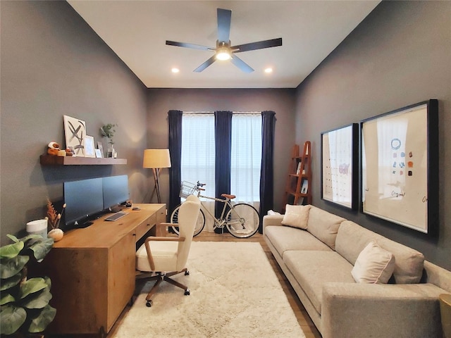 office space featuring light wood-type flooring and ceiling fan