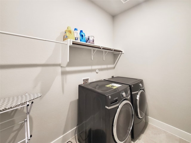 laundry area featuring washing machine and dryer