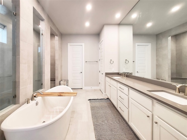 bathroom featuring vanity and plus walk in shower