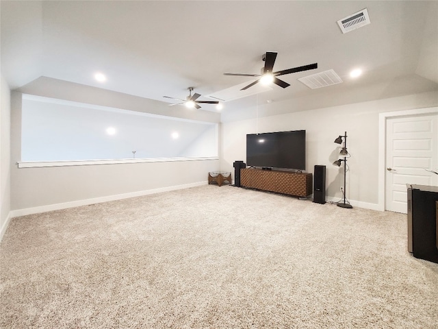 unfurnished living room featuring vaulted ceiling, light carpet, and ceiling fan