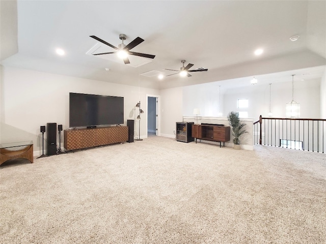 carpeted living room with ceiling fan