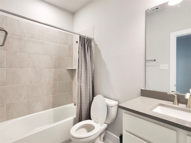 full bathroom with vanity, shower / bath combo with shower curtain, and toilet