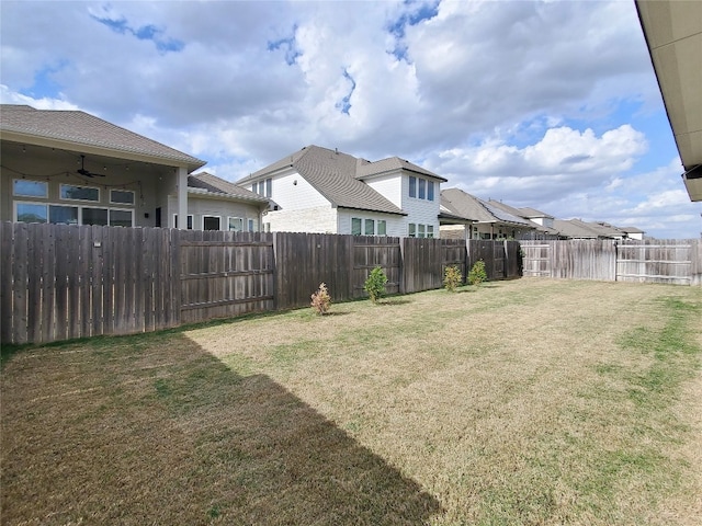 view of yard featuring ceiling fan