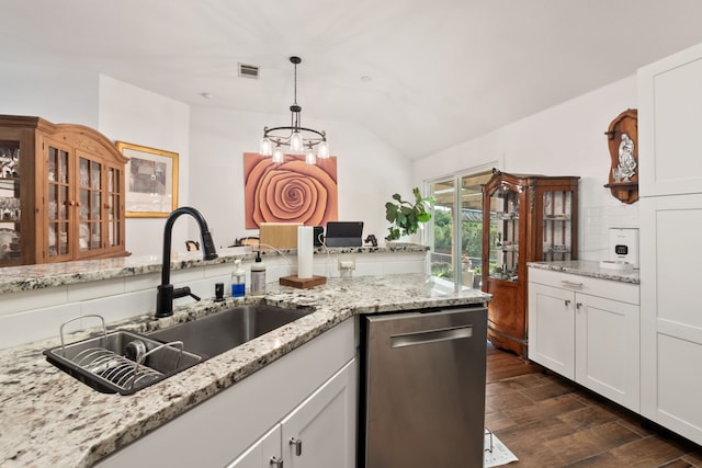 kitchen featuring stainless steel dishwasher, sink, pendant lighting, an inviting chandelier, and white cabinetry