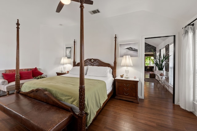 bedroom with ceiling fan, dark hardwood / wood-style flooring, and lofted ceiling