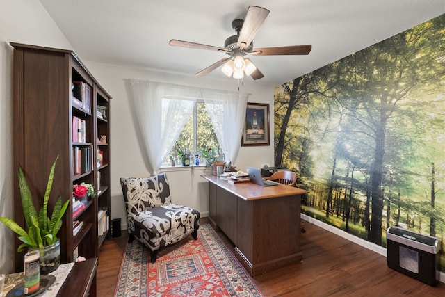 home office featuring dark hardwood / wood-style floors and ceiling fan