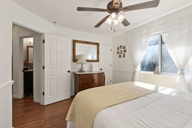 bedroom with ceiling fan and dark hardwood / wood-style floors