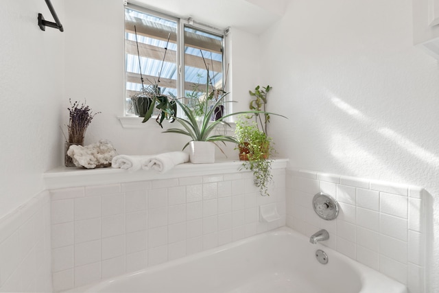 bathroom featuring a tub