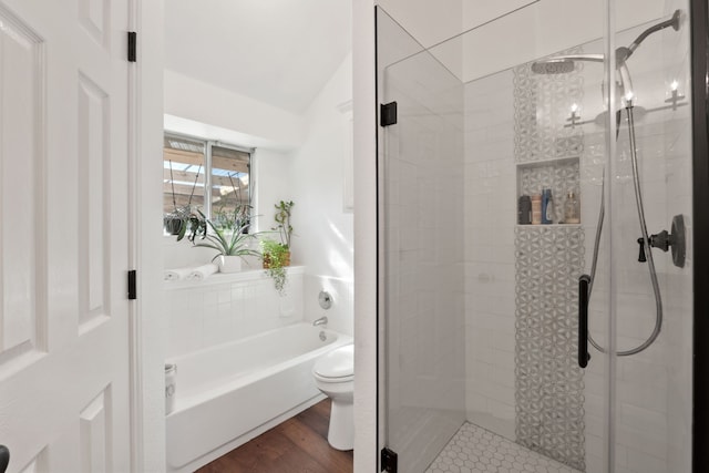 bathroom featuring hardwood / wood-style floors, toilet, and independent shower and bath